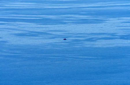 The calm, clear sea, lonely yacht in the sea