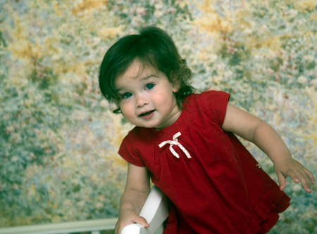 Portrait of a beautiful little girl in the room