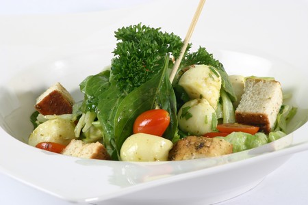 Green Salad in a White bowl, on a white backgroundの写真素材