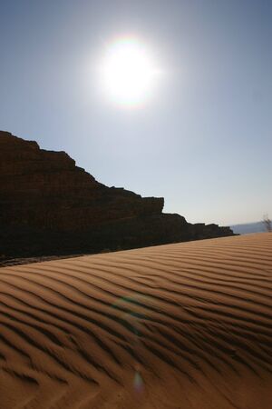 Desert Sand Dunes in Wadi Rum - Jordan, with a sunset panoramic viewの写真素材