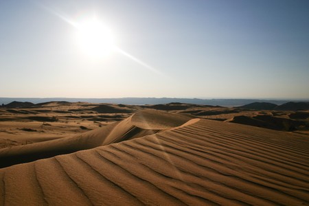 Desert Sand Dunes in Wadi Rum - Jordan, with a sunset panoramic viewの写真素材
