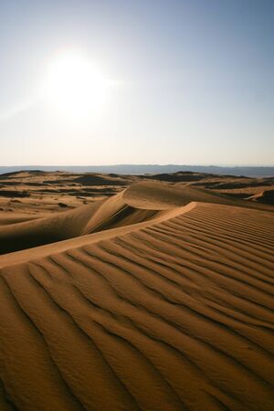 Desert Sand Dunes in Wadi Rum - Jordan, with a sunset panoramic viewの写真素材