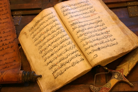 Old Antique Handwritten Qura'an, with a leather message & Swordの写真素材
