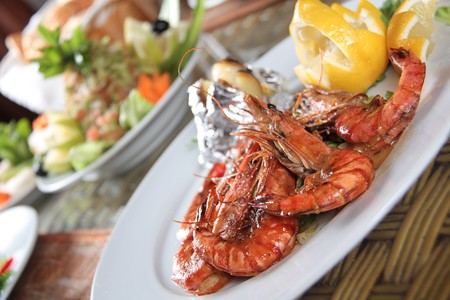Grilled Shrimps dish with lemon & appetizersの写真素材
