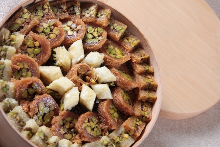 Round Wooden box of a mix Arabic sweets (Mabroumeh)の写真素材