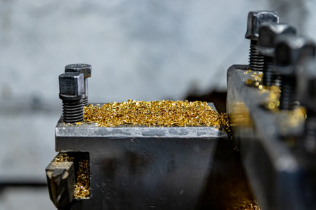 Colored chips from the work of the lathe production lies on the machine parts. soft focus. close-up