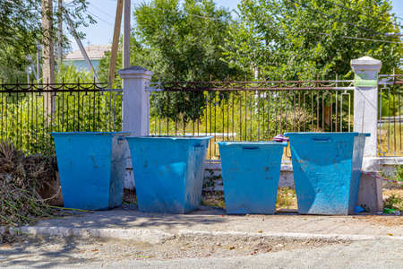 Trash cans on the street. The concept of environmental pollution.