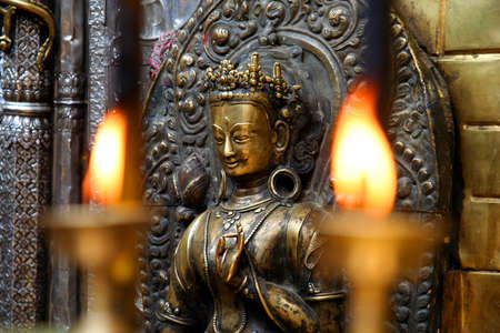 candles burning inside one of the Buddhist temples in Nepal