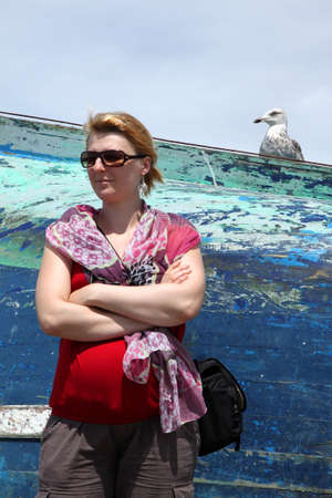 Tourist  in the company of seagull, Essaouira port, Moroccoの写真素材