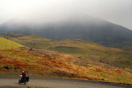 Girl cycling in Torres del Paine National Park, Chileの写真素材