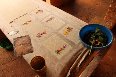 Pages of hand made paper decorated with dried flowers, traditional paper faktory, Ambalavao,...