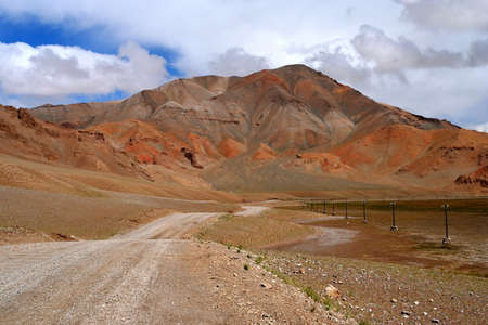 Mountain road through the high central Tibetan plateau, Tibet, Chinaの写真素材