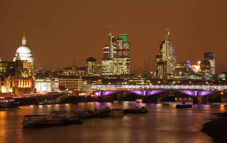 Night skyline of London with St  Pauls cathedral and commercial buildings as seen from the Waterloo bridgeのeditorial素材