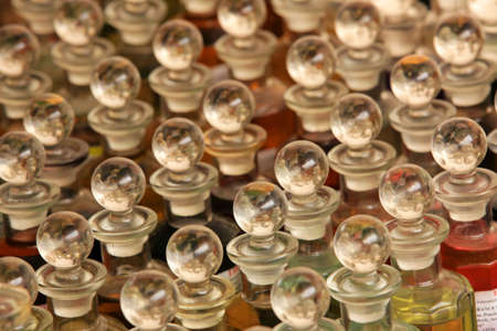 Row of small bottles containing scented oils on sale on Brixton market