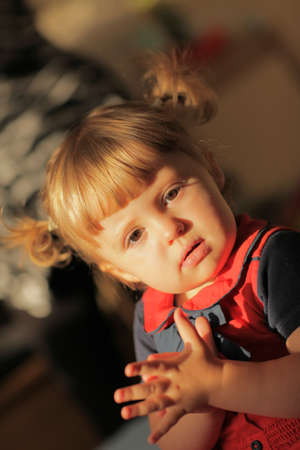 Portrait of a cute little baby girl with the ponytails