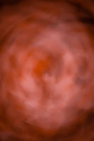Abstract picture of a blurred misty red backgroundの写真素材