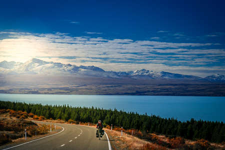 Woman on a cycle touring trip in New Zealand の写真素材