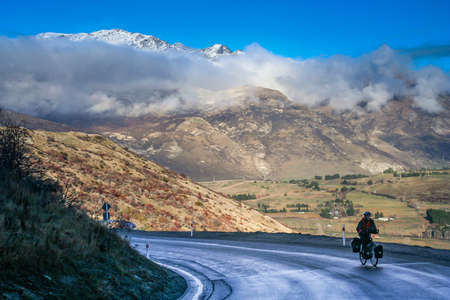 Woman on a cycle touring trip in New Zealandの写真素材