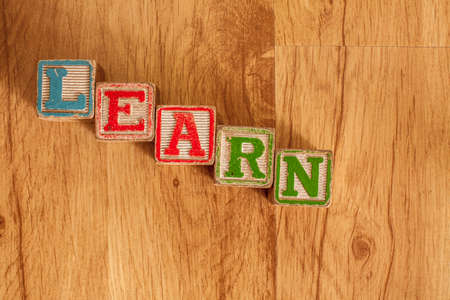Vintage Wooden Children s Blocks spell out the word Learnの写真素材