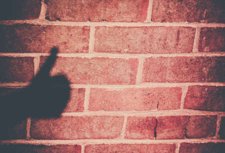 Shadow of a man s hand showing Thumbs Up signの写真素材
