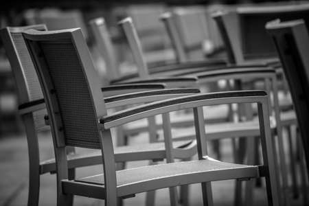 Empty chairs outside popular restaurant in Londonの写真素材