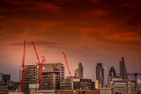 Cranes above London building sites with The Gherkin in the backgroundの写真素材