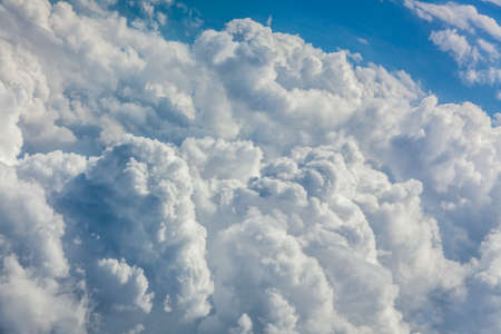 Horizontal picture of clouds in the sky seen from aboveの写真素材