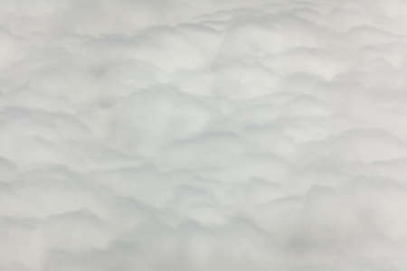 Horizontal picture of clouds in the sky seen from aboveの写真素材