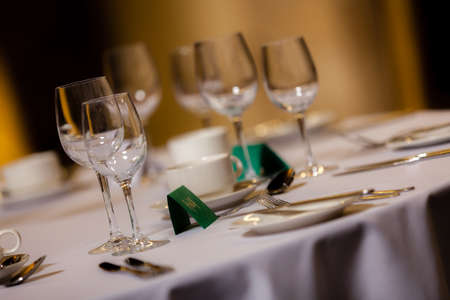 Wine glasses on the table before wedding dinnerの写真素材