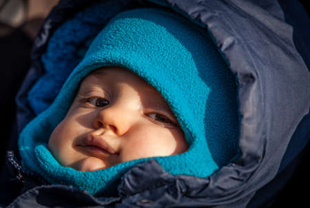 Portrait of a cute baby boy in his jacketの写真素材