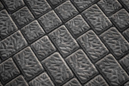 Close up of a grey tiles on a street