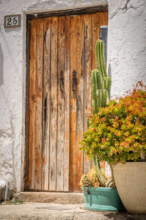 Wooden doors to one of the homes in Fataga in Gran Canaria Canary Islandsの写真素材
