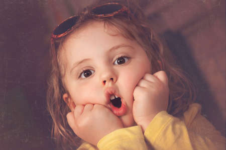 Home taken portrait of a cute little baby girlの写真素材