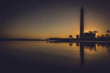 Lighthouse in Maspalomas in Gran Canaria during sunsetの写真素材