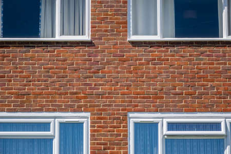 Shapes and pattern of four windows in a block of flatsの写真素材