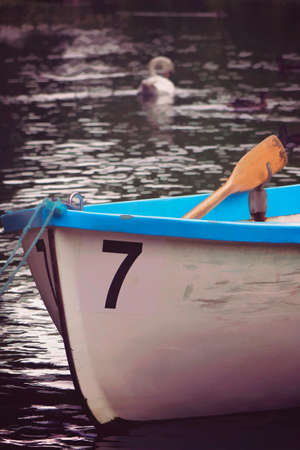 Small boat to rent for tourists at the lakeの写真素材