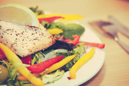 Roast salmon and peppers salad prepared for lunchの写真素材
