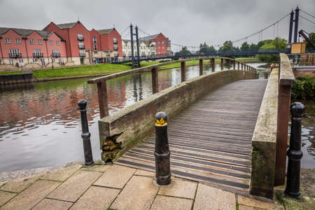 Small pedestrian bridge in the Exeter Quay, Devon, England, UKの写真素材