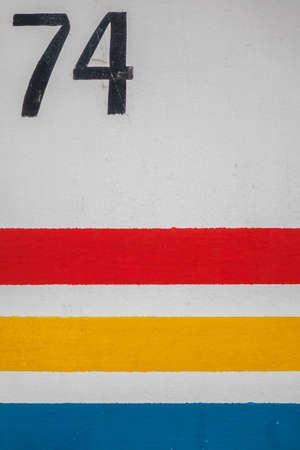Number 74 on a wall of a home in Paignton seaside resort