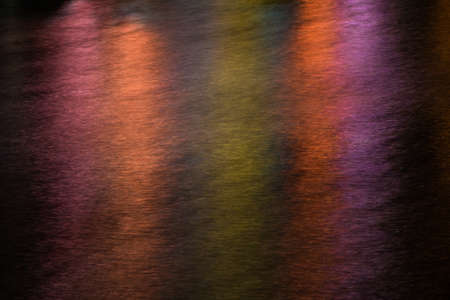 Abstract multicolour lights pattern created on a river surfaceの写真素材