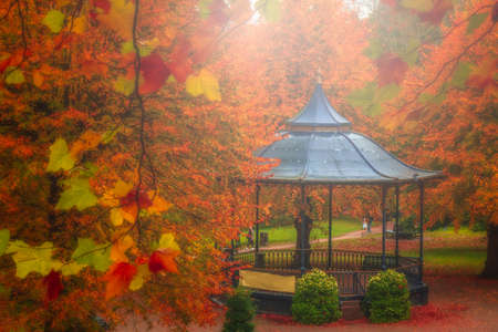 Arbor in a beautiful park in autumn, Colchester, England, UKの写真素材