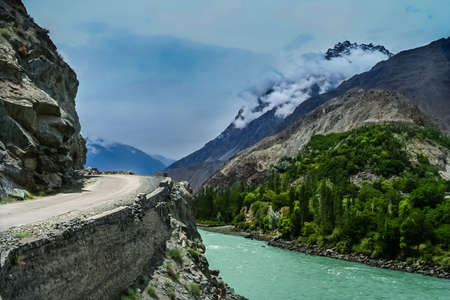 Beautiful road alonge the Gilgit river in the  Karakorum mountains in Pakistanの写真素材