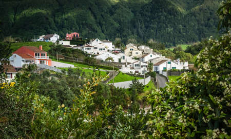 White homes in Furnas town, which lies in the volacano crater, Sao Miguel, Azores, Portugal