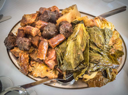 Traditional Furnas stew which is cooked for many hours in the volcanic vents in the ground. It consists of various meats - chicken, beef, pork, chorizo, lamb as well as potatoes and cabbageの写真素材