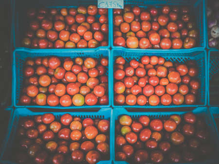 A pile of tomatoes on sale on a market in Ponta Delgada, Azores, Porugalの写真素材
