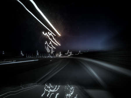 Picture of cold blueish random abstract light trails. Picture taken when driving at night.