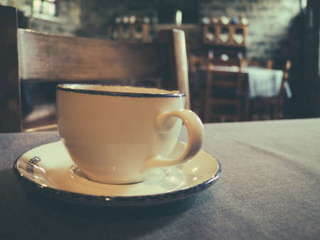 Tea cup on a table in a traditional tearoom in an old tea factoryの写真素材