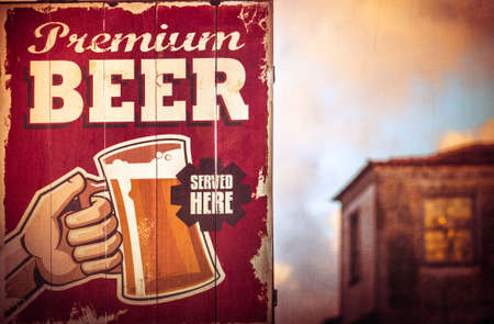 Wooden sign above pub indicating that beer is served hereの写真素材