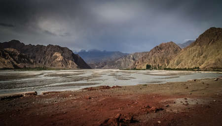 Wide river valley in the Karakorum mountains, Xinjang, Chinaの写真素材