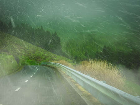 Snowfall on a winding mountain road in Europe